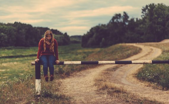 better boundareis: girl sitting by railway crossing